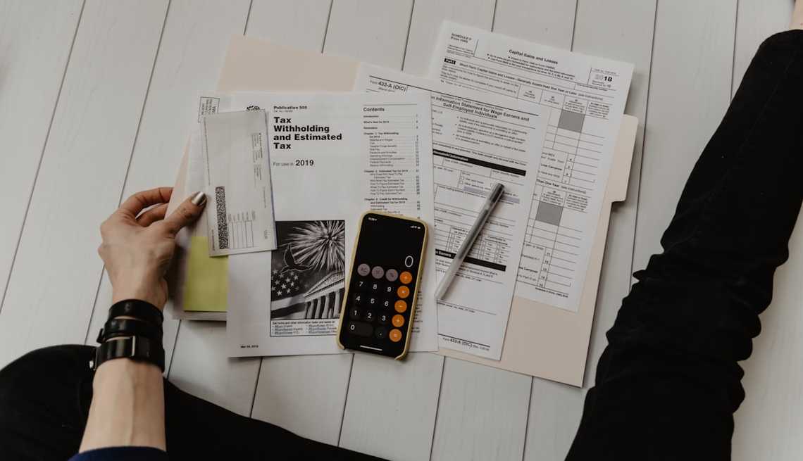 Financial documents and tax forms representing California's history of inflation relief programs